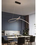 Sturdy Iron Framed LED Pendant Lamp With Smooth Remote Dimming And Warm White Glow, suspended over a modern dining table.