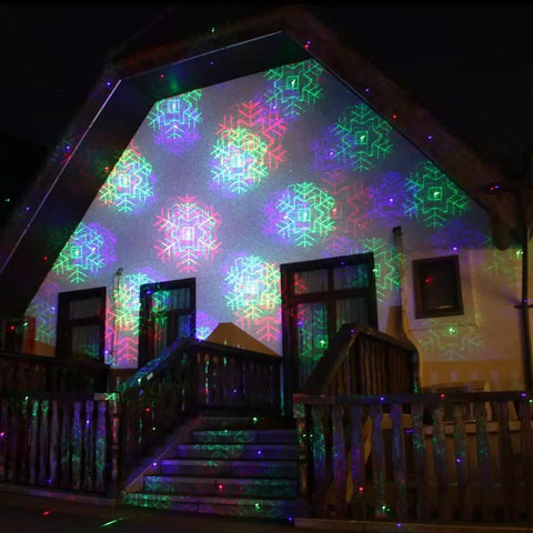 Motion Pattern Firefly 3 In 1 RGB Outdoor Laser Christmas Lights Projector With 18 Moving Patterns illuminating a house facade