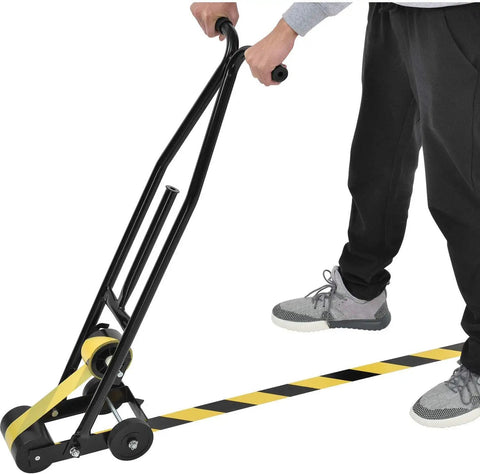 Heavy Duty Floor Tape Applicator For Zero Sweat Safety Line Layout With Dual Comfort Grip Handles and Rock Solid Steel Frame in use laying tape.