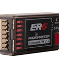 Close-up of ExpressLRS 2.4GHz 6 Channel PWM Receiver for FPV Drones, Airplanes and Gliders showing connection ports.
