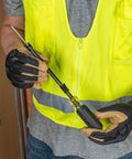 Worker holding a One Handed Phillips Screw Holding Screwdriver With 7 Inch Round Shank Cushion Grip Handle For Superior Torque