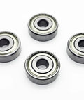 Get A Buttery Smooth Ride With These Heavy Duty Wheelchair Rear Bearings 4 Pack Universal 11mm showing four sealed bearings on white background.
