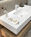 Heavy Duty Rubber Drain Stopper With Sturdy Pull Ring, Six Piece Set Of White Sink Plugs on modern sink countertop.