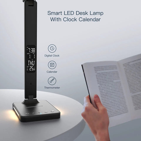 LED desk lamp with wireless charger, USB port, dimmable light, thermometer, digital clock, calendar display next to an open book.