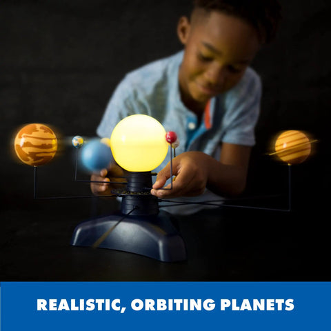 Motorized Solar System Model for Kids With Realistic Orbits, Hands On STEM Learning Toy for Exploring Planets and the Sun at Different Speeds, Interactive Space Educational Kit for Young Astronomers; child adjusts glowing planet model