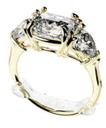 Invisible Ring Size Adjuster For Loose Rings With Six Sizes Keeps Your Engagement And Wedding Rings Snug And In Place No More Slips Clear Ring Band Sizer Guard For Loose Jewelry Multipack Ten Count installed on a gold engagement ring.