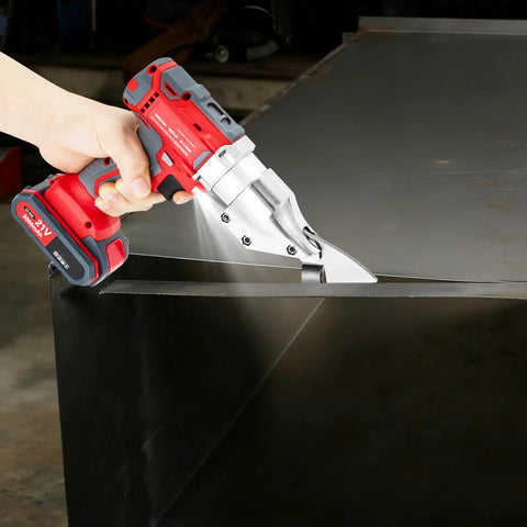 21V Brushless Cordless Sheet Metal Shear With Two Batteries And 360 Degree Pivoting Head cutting through stainless steel sheet.