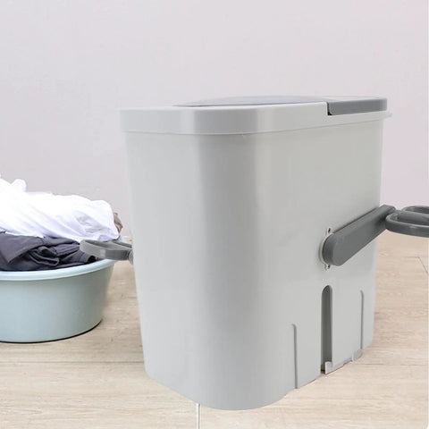 Hand Crank Portable Washing Machine No Sweat Laundry Solution Compact Camping Washer For Dorms And RV Life Eco Friendly Manual Tumbler side view with clothes nearby.