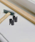Heavy Duty Wire Shelf Lock Clips for 1.5 Inch Posts, 32 Pack; black plastic clips near hammer and wood