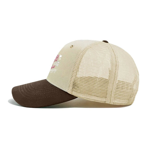Side view of Cruise Ready Trucker Hat For Women And Men Unisex Sports Cap with ventilated mesh top and bold front artwork.