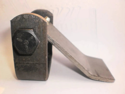 Close-up of one of two heavy duty door hinges for dump trailers and freight trucks, greasable strap style cargo door hardware.