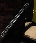 Custom Length Clear Acrylic Handrail System with Beefy Stainless Steel Mounting Brackets on dark staircase wall.