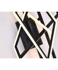 Killer Matte Black Led Wall Sconce With Sleek Stainless Steel Frame And Warm 3000K Glow To Level Up Your Bedroom Hallway Or Entryway Decor Setup Game, overhead view with warm light.