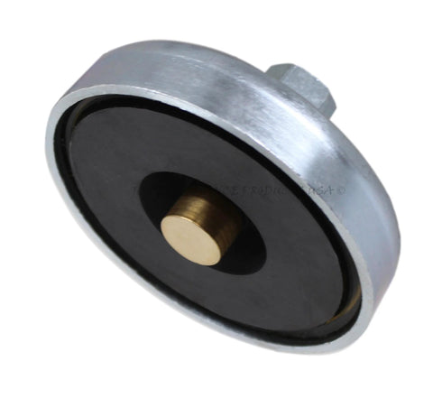 Close-up view of a spring-loaded magnetic welding ground clamp with silver housing, black insulator, and brass center contact.