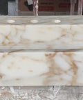 Top Shelf Hand Carved Afyon Honey Marble Bathroom Vanity Sink With Slick Countertop Setup And Durable Natural Stone Craft For Upscale Residential Or Swanky Commercial Decor. View of smooth top surface with faucet holes.