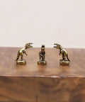 Magnetic Hinge Head T Rex Set Of 3 Miniature Door Topper Figures on wooden surface