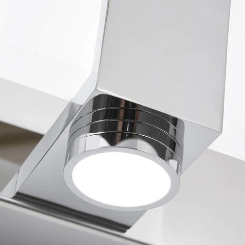 Close-up of Over Mirror Vanity Lights Three Light Modern Chrome Fixture for Bathroom Stainless Steel Frame with Acrylic Shade