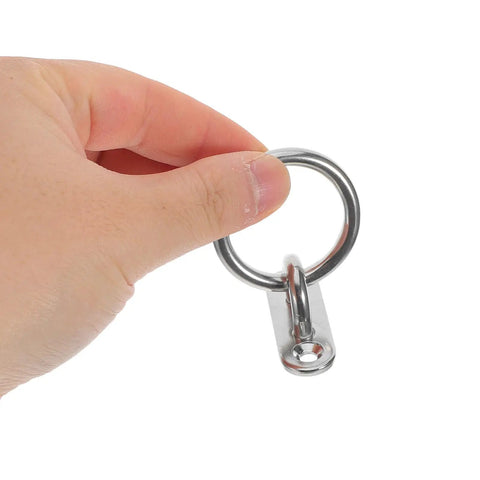 Hand holding a Rock Solid Stainless Steel Pad Eye Plate with M5 threads, ideal for marine rigging and hammock suspension.