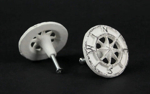 Rock Solid Compass Rose Drawer Pulls Set Of 12 In Antique White Cast Iron Nautical Cabinet Handles Featuring Smooth Grip and Killer Design For Effortless Kitchen And Bathroom Hardware Refresh, showing two round drawer pulls.