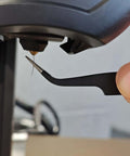 Using tweezers from the Complete 42Pcs 3D Printer Nozzle Cleaning Tool Kit for extruder maintenance on a 3D printer.