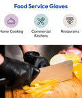 Person using Black Nitrile Disposable Gloves 4 Mil Thick 200 Pack Latex Free for food prep in kitchen.