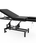 Black Electric Spine Massage Table With Dual Motors And Hydraulic Lift Adjustable Waist Support For Physical Therapy Facial Spa Waxing And Tattoo Clinics Versatile Treatment Bed side view with adjustable headrest.