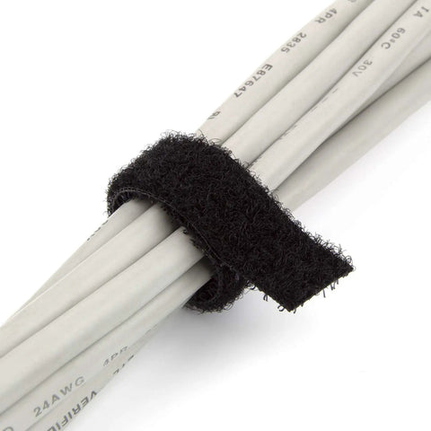 Black fire retardant reusable cable tie securing white cables, half inch wide, 16 feet long, shown in close-up for organization.
