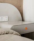 Side view of bedside table with Five Pack Flower Drawer Knobs In Orange Zinc Alloy Cabinet Dresser Pulls, installed on drawer.