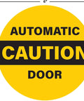 Image of a 6-inch diameter yellow caution automatic door sticker for sliding glass doors, double-sided weatherproof vinyl decal.