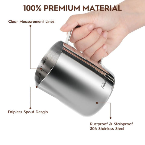 Hand holding 12 oz stainless steel milk frothing pitcher with measurement lines, part of Stainless Steel Milk Frothing Pitcher Set With Latte Art Pen Go To All In One Size Options 12 Oz 20 Oz 32 Oz 50 Oz Steam Pitchers For Frothing Milk Cappuccino And Latte Art Barista Grade Jug.