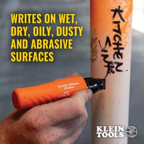 XL Chisel Tip Permanent Marker For Multi Surface Jobsite Use Black Ink That Writes On Wet Oily And Dry Surfaces With Industrial Grade Performance And A Clog Resistant Tip Skribes XL Marker in use on a pipe