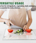 Person slicing cucumber on Tempered Glass Cutting Boards Set For Kitchen Counters 2 Pack 16x12 And 12x8 Inches Non Slip Grippy Bottom
