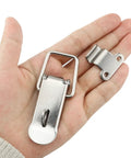 Hand holding 74mm Stainless Steel Tool Box Hood Locks Latches Set With Spring Loaded Toggles Clasp Buckles Hasps 90 Degree Right Angle