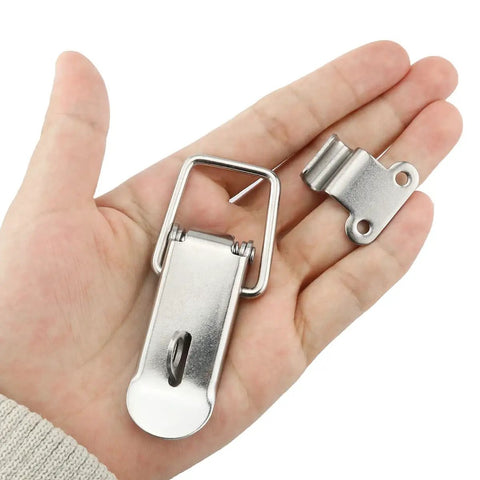 Hand holding 74mm Stainless Steel Tool Box Hood Locks Latches Set With Spring Loaded Toggles Clasp Buckles Hasps 90 Degree Right Angle