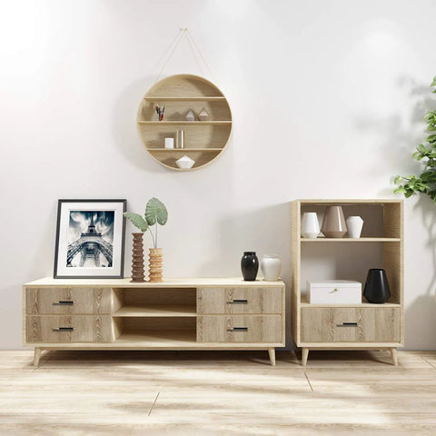 Modern living room with wooden media console, black handles, decorative vases, framed art, and open shelving against white wall.