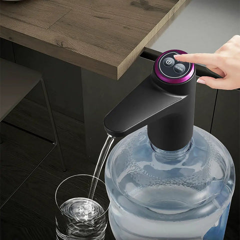 Portable Water Dispenser For 2 To 5 Gallon Bottles With USB Charging Pump in use, dispensing water from a large bottle into a glass.
