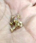 Gold Flat Head Turn Lock Screws 40 Pack Small Phillips Replacement Hardware Kit With Tool For Purses Handbags Wallet Totes Quilted Bags No Sweat Repair Set held in a hand.