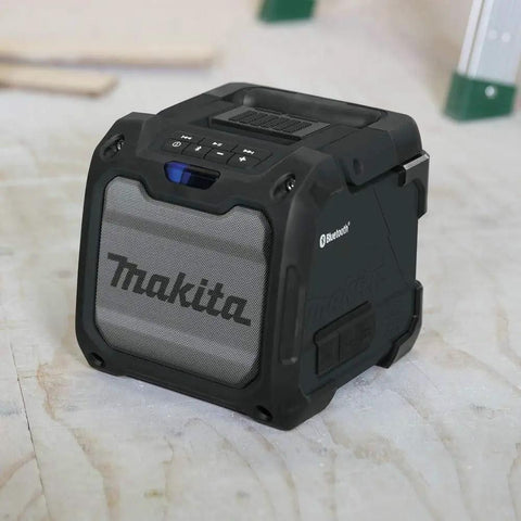 Cordless Job Site Bluetooth Speaker For Power Tools 18V LXT And 12V Max CXT Lithium Batteries on workshop floor, rugged design.