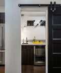 Top Shelf Ebony Black Oil Wood Stain For Patios And Decks Hella Durable Penetrating Formula That Gonna Make Your Wood Look Sick With A Smooth Matte Black Finish And Tough Protection in a modern kitchen with a sliding barn door.
