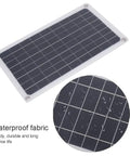 20W Monocrystalline Solar Charger Outdoors With Dual DC Output And USB Goes Off Grid For 12V Batteries Powers Camping And RV Life Weatherproof Silicon Panel High Efficiency Eco Friendly showing waterproof surface.