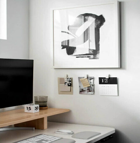 Office wall with Quartz Plastic Spring Clips 8 Pack For Dorm Décor Damage Free Hanging, holding notes and a small calendar.