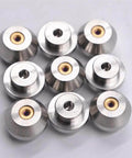 Nine silver waterjet orifice nozzles with brass inserts, metal tooling components