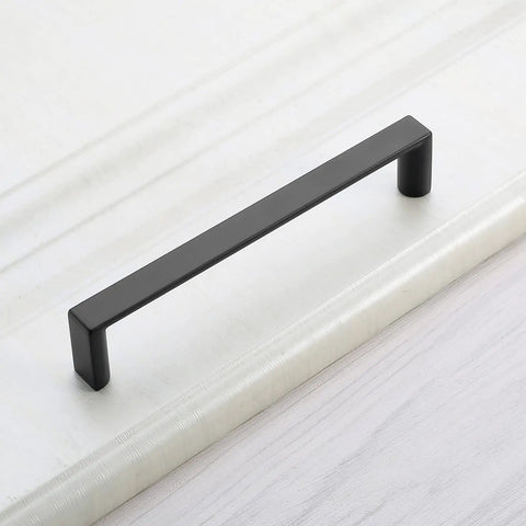 Sleek Five Inch Matte Black Cabinet Handles And Drawer Pulls For A Total Kitchen Glow Up With Solid Zinc Alloy Construction And 128 mm Center Spacing Fits Dressers Cupboards And Wardrobes Perfectly Includes Ten Pieces - close-up of a matte black cabinet pull.