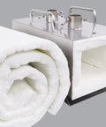 Heavy Duty Ceramic Fiber Insulation Blanket For Wood Stove Fireplace And Pizza Oven High Temperature Thermal Wrap Handles Direct Flames Like A Champ 60 By 24 Inch Refractory Heat Shield rolled up and heat shield in metal base.