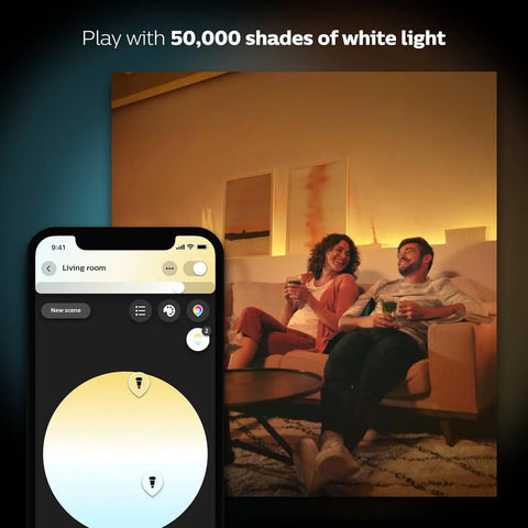 Couple enjoying warm white light from White Ambiance BR30 LED Smart Bulbs with Bluetooth control, phone app interface shown.