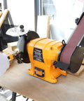 Tough As Nails 2 IN 1 Bench Grinder And 2X27 Inch Belt Sander Combo driving a 250W motor on woodwork table.