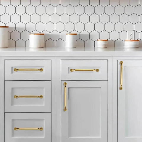 Top Shelf 5 Pack Solid Brass Cabinet Pulls 3 Inch Center-To-Hole Handles In Unlacquered Brass Finish on white cabinetry