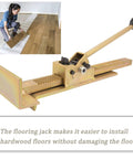 Flooring Jack For Hardwood Floors Pro Grade Positioning Tool DIY Friendly For Installing Straightening Laminate Wood Tile Floors Heavy Duty Steel Build Easy On Surfaces, shown with a person using it on wooden floor.
