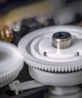 Plastic Gear Set For RC Cars And DIY Robots, 20 Pcs Of 42 Teeth Reduction Gears, showing white gear mechanism close-up