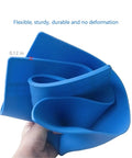 Person holding flexible, blue Heat Resistant Soldering Mat Silicone Repair Pad 932F 16x12 Inch, showing 0.12 inch thickness.